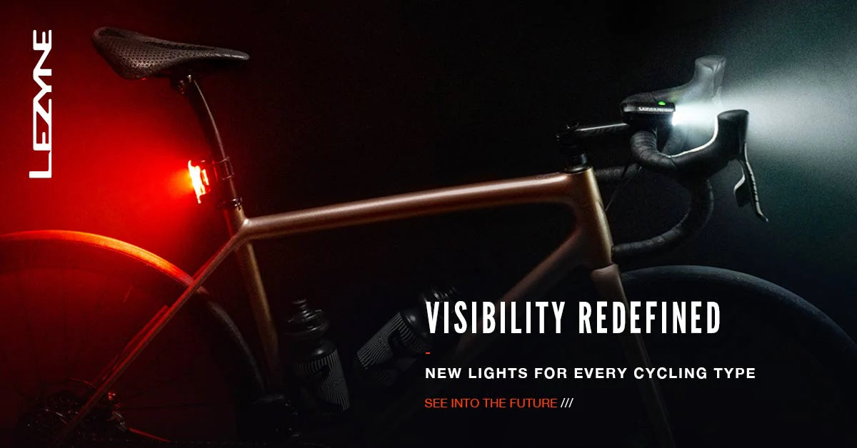 Bike with beams of light emitting from front and rear bike lights. The words Visibility Redefined - New Lights for Every Cycling Type written below.