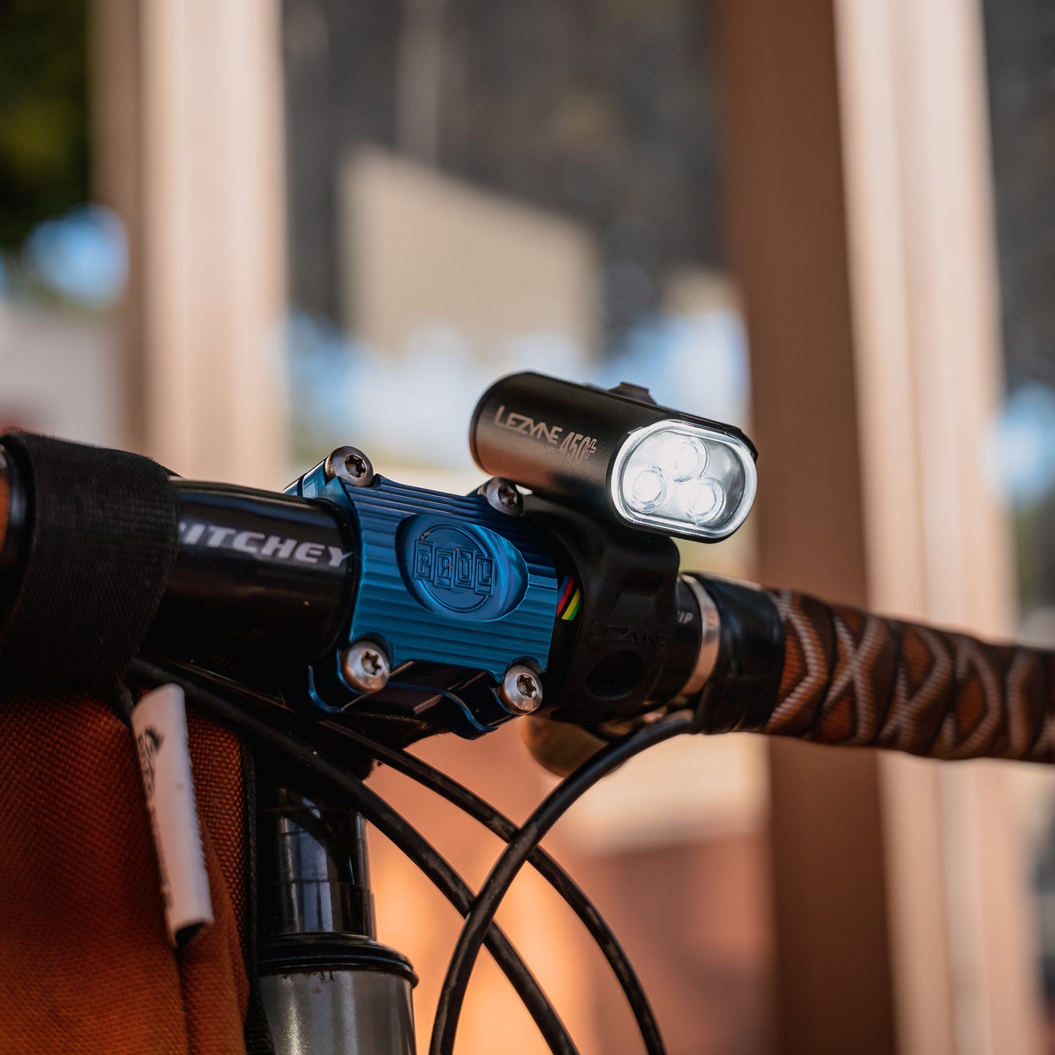 Lezyne Mini Drive 450+ Front mounted on a handlebar and shining brightly for daytime visibility