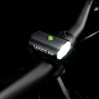 Top-view studio shot of the Lezyne Mini Drive 450+ Front with illuminated multifunction button
