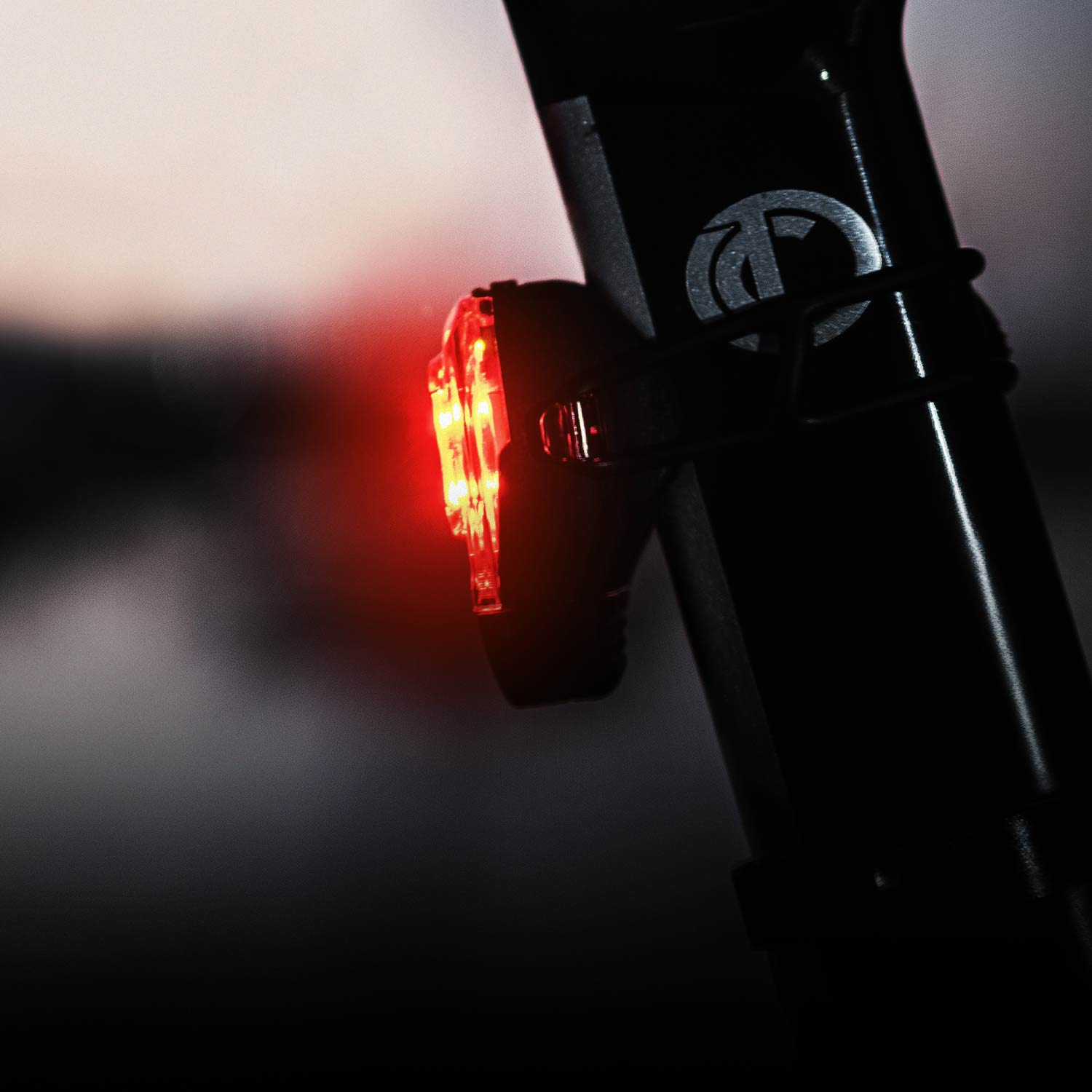 A side view of a bicycle light mounted on a seat post.