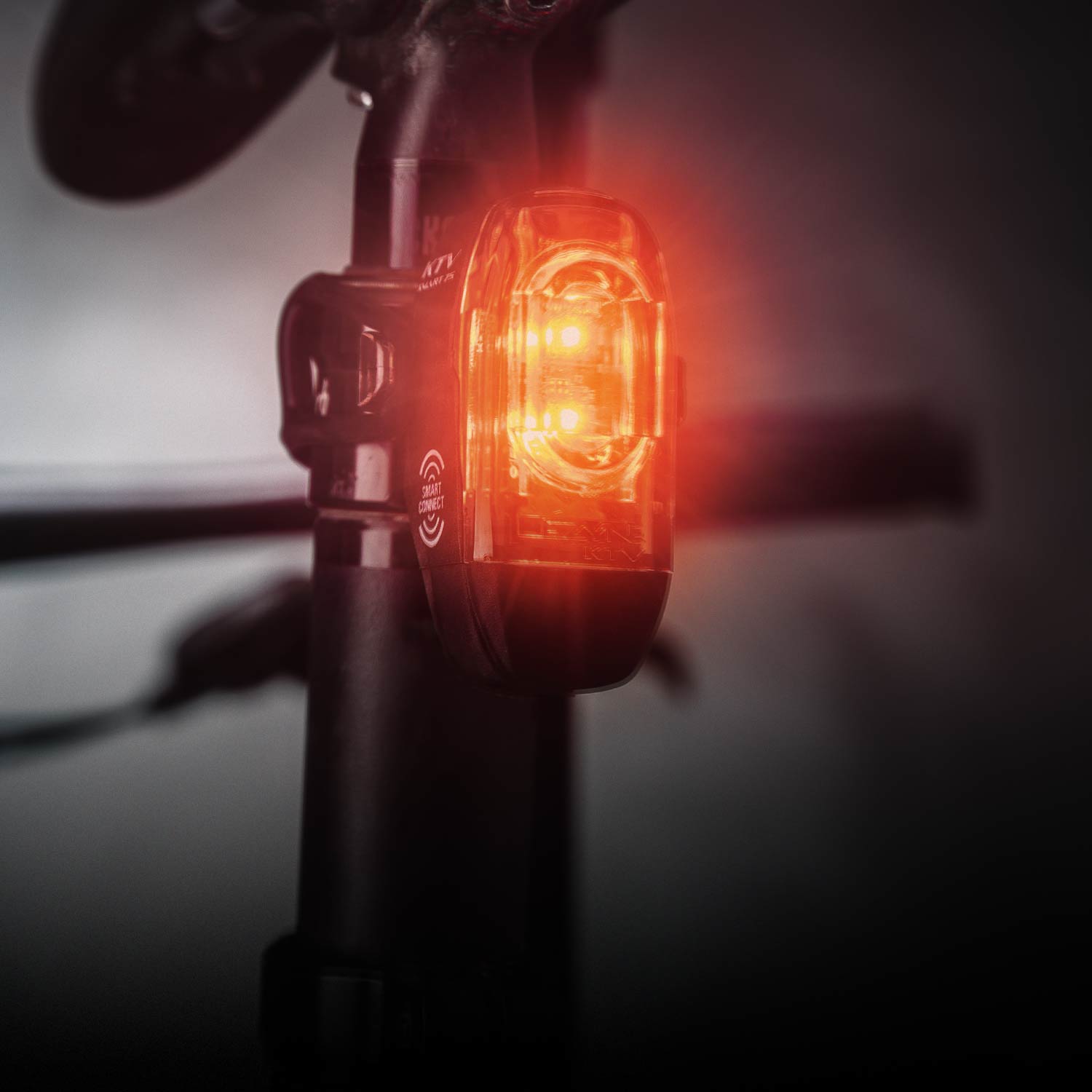 A rear bicycle light mounted on a seat post. The smart connect and KTV logos are visible on the side of the light.