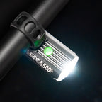 Bird's-eye view of the Lezyne Macro StVZO 500+ Reverse LED light, mounted upside down on the handlebars, angled downwards to the right, with a green circular power light on top.