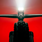Mega Drive 2400+ LED front bike light mounted on a mountain bike handlebar.