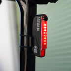 STICK+ DRIVE LED rear bike light mounted on seatpost, bright beam, high visibility for road, gravel & commuter cyclists.