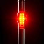 Front view of the Lezyne Strip+ StVZO Rear LED taillight, emitting a bright red light, mounted on the seatpost.