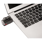 Black  KTV Drive front bike light charging using a laptop