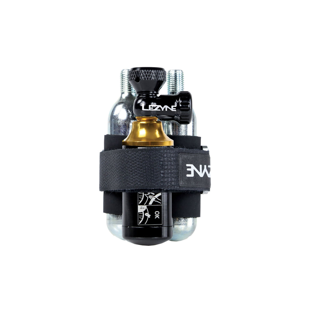 Compact Lezyne Tubeless CO2 Blaster set with dual CO2 cartridges, aluminum build, and plug storage canister.