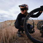 Lezyne Pocket Drive HV. Compact high volume hand pump in use, pumping up Mountain bike tire.