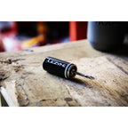 Small yet versatile Lezyne Tubeless Kit with sturdy stainless steel reamer and adhesive repair plugs for tubeless tires.