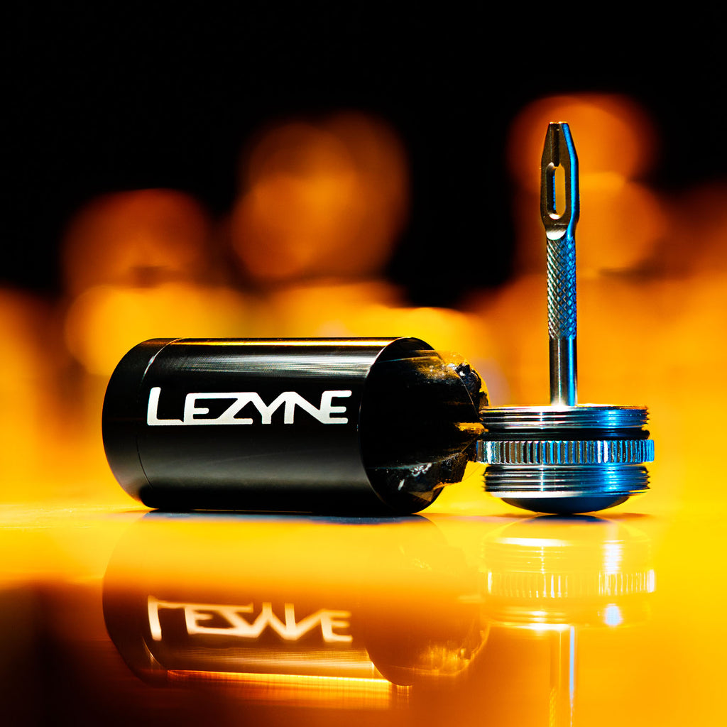Lezyne Tubeless repair kit with reamer shown open w/ plug strips. Stored in a sleek aluminum handle for portability.
